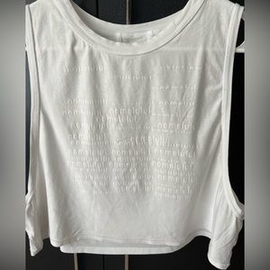 Lululemon White tank. Smoke/pet free. Worn less than 10 times.  Size: 10 or 12